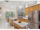 Bright kitchen with stainless steel appliances, stone countertops, and an island for food prep at 224 Bluestone Pl, Casselberry, FL 32707