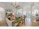 Open-concept living room with tile floors, neutral color scheme, and seamless transition to dining area at 224 Bluestone Pl, Casselberry, FL 32707