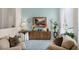Elegant living room featuring stylish decor, a wooden console, and comfortable seating at 224 Bluestone Pl, Casselberry, FL 32707