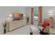 Cozy living area featuring a relaxing chair, television set, and neutral decor at 224 Bluestone Pl, Casselberry, FL 32707