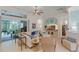 Bright living room with tile floors and sliding glass doors that lead to a screened patio at 224 Bluestone Pl, Casselberry, FL 32707