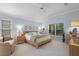 The main bedroom offers natural light from the window, neutral decor and an adjoining sitting area at 224 Bluestone Pl, Casselberry, FL 32707