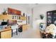 Spacious home office area featuring a large desk, shelving and relaxing seating area at 224 Bluestone Pl, Casselberry, FL 32707