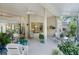 Well-lit screened patio featuring ceiling fan, comfortable seating, and seamless indoor-outdoor flow at 224 Bluestone Pl, Casselberry, FL 32707
