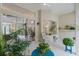 Bright screened-in lanai showcasing ceiling fan, comfortable seating, and seamless flow to the backyard at 224 Bluestone Pl, Casselberry, FL 32707