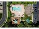 Aerial view of the community pool, playground, parking, and building at 2743 River Landing Dr, Sanford, FL 32771