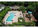 Aerial view of the community pool and playground with lounge chairs at 2743 River Landing Dr, Sanford, FL 32771