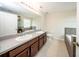 Elegant bathroom with a double vanity, a separate shower, and a soaking tub at 2743 River Landing Dr, Sanford, FL 32771