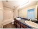 Bathroom features a double sink vanity, shower-tub combo, and tile flooring at 2743 River Landing Dr, Sanford, FL 32771