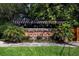 Stone entrance sign for the Riverview community framed by lush landscaping and a pergola at 2743 River Landing Dr, Sanford, FL 32771