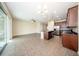 Open-concept living and kitchen area with a sliding glass door at 2743 River Landing Dr, Sanford, FL 32771