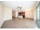 Spacious living area flowing into the kitchen with tile flooring and neutral paint at 2743 River Landing Dr, Sanford, FL 32771