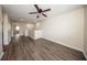 Spacious loft features wood floors, neutral walls, ceiling fan, and natural light at 2743 River Landing Dr, Sanford, FL 32771