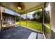 Screened in porch with ceiling fan overlooking the green backyard at 2743 River Landing Dr, Sanford, FL 32771