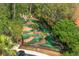 An outdoor mini golf course with challenging fairways, landscaping, and paving at 2769 Lido Key Dr, Kissimmee, FL 34747