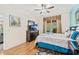 Bedroom with hardwood floors, ceiling fan, and a window at 2769 Lido Key Dr, Kissimmee, FL 34747