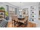 This dining room has a stylish chandelier, decorative shelving, and hardwood floors at 2769 Lido Key Dr, Kissimmee, FL 34747