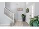 Inviting foyer with staircase, decorated with a 'Blessed' sign and potted plant at 2769 Lido Key Dr, Kissimmee, FL 34747
