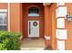 Close-up of front entrance with elegant wreath and colorful floral accents at 2769 Lido Key Dr, Kissimmee, FL 34747