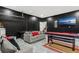 A large recreational room with black brick walls, a sofa, and a full size pool table at 2769 Lido Key Dr, Kissimmee, FL 34747