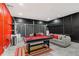 The game room features a pool table, black brick walls, a sofa, and a table tennis setup at 2769 Lido Key Dr, Kissimmee, FL 34747