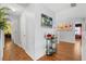 Upstairs hallway with hardwood floors and decorative art at 2769 Lido Key Dr, Kissimmee, FL 34747