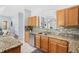 Well-equipped kitchen featuring granite countertops and modern backsplash at 2769 Lido Key Dr, Kissimmee, FL 34747