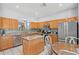 Spacious kitchen featuring granite countertops, stainless steel appliances, and a center island at 2769 Lido Key Dr, Kissimmee, FL 34747