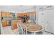 The kitchen features granite countertops, stainless steel appliances, a central island and breakfast nook at 2769 Lido Key Dr, Kissimmee, FL 34747