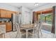 Cozy kitchen with dining area, stainless steel appliances, and sliding door access to patio at 2769 Lido Key Dr, Kissimmee, FL 34747