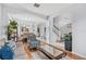 Open-concept living room that is bright and airy, with hardwood floors and an arched entryway at 2769 Lido Key Dr, Kissimmee, FL 34747