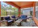 Beautiful screened patio with rattan furniture and a view of the backyard at 2769 Lido Key Dr, Kissimmee, FL 34747