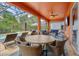 Spacious screened-in patio with ample seating, ceiling fan, and a backyard swimming pool at 2769 Lido Key Dr, Kissimmee, FL 34747