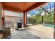 Screened in patio with chairs, a BBQ grill, and a view of the backyard pool at 2769 Lido Key Dr, Kissimmee, FL 34747
