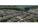 Aerial view of a house in a Gathering-friendly neighborhood with nearby lake access and easy access to shopping at 3138 Twin Shore Ln, Orlando, FL 32824
