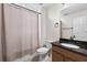 Clean bathroom featuring a toilet, sink with granite countertop, and shower with curtain at 3138 Twin Shore Ln, Orlando, FL 32824