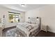 Stylishly decorated bedroom featuring a modern bed frame, plush rug, and ample natural light at 3138 Twin Shore Ln, Orlando, FL 32824