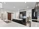 Modern kitchen with black cabinets, a white countertop, and a large kitchen island at 3138 Twin Shore Ln, Orlando, FL 32824