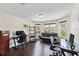Well-lit office space with multiple workstations and windows, creating a productive environment at 3138 Twin Shore Ln, Orlando, FL 32824