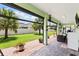 Expansive covered patio with brick pavers and outdoor seating, perfect for enjoying the landscaped backyard at 3138 Twin Shore Ln, Orlando, FL 32824