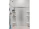 Close-up of a white shower with built-in shelving for toiletries and soap at 3727 Bluethread Way, Poinciana, FL 34759