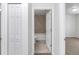 A full bathroom showing a tub and tile work, viewed from the hallway at 3914 Sw 161St Loop, Ocala, FL 34473
