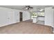 Open floor plan showcasing carpeted living room and modern kitchen island, perfect for entertaining at 3914 Sw 161St Loop, Ocala, FL 34473