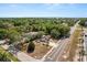 An aerial view of a home with lush tree coverage at 4070 Mcneil Rd, Apopka, FL 32703