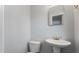 Bathroom featuring white pedestal sink and toilet at 4070 Mcneil Rd, Apopka, FL 32703