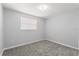 Carpeted bedroom featuring a window for natural light and neutral wall color at 4070 Mcneil Rd, Apopka, FL 32703