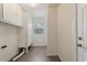 Laundry room with built-in cabinets at 4070 Mcneil Rd, Apopka, FL 32703