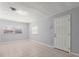 Living room with tile floors, large windows, and a front door at 4070 Mcneil Rd, Apopka, FL 32703