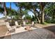 Backyard patio featuring a beautiful brick paved area, comfortable seating, and a fire pit at 4199 Conway Place Cir, Orlando, FL 32812