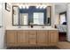 Bathroom featuring a double vanity with lots of counter space and bright lighting, complemented by an inviting bedroom view at 4199 Conway Place Cir, Orlando, FL 32812